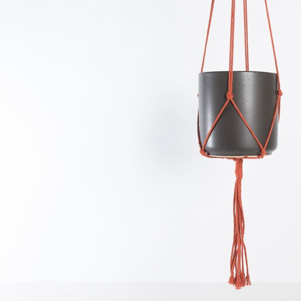orange macrame plant hanger Macrame Plant Hanger - Burnt Orange